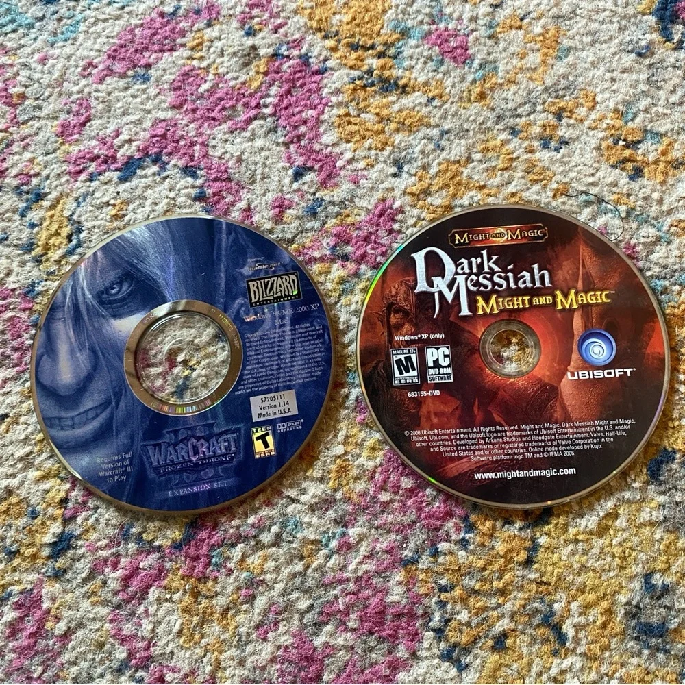 Blizzard Warcraft and Ubisoft Dark Messiah PC Game Discs